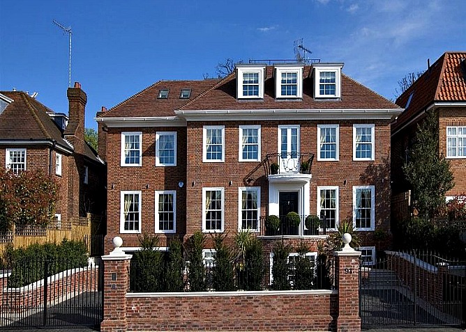 Detached, six bedroom Hampstead property with magnificent reception, games room, private gym, garden, garage and gated carriage driveway is close to excellent transport links, Hampstead Heath and Golders Hill Park